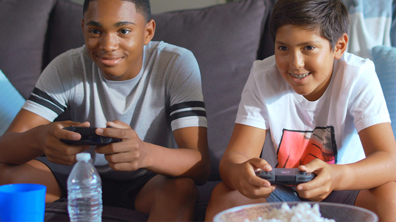 Students playing a game console